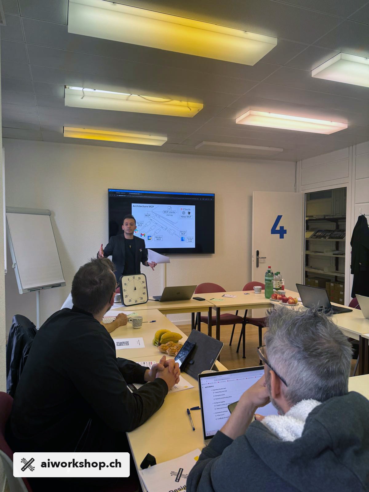 Participants working in small groups during the Agentic AI workshop at Espace Dickens